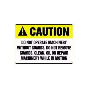 CAUTION DO NOT OPERATE MACHINERY WITHOUT GUARDS. DO NOT REMOVE GUARDS 