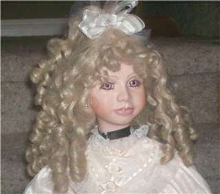 THIS IS A PORCELAIN DOLL, I DONT THINK I HAVE EVER SEEN PRESENTED ON E 