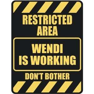   RESTRICTED AREA WENDI IS WORKING  PARKING SIGN