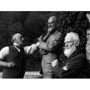  George Bernard Shaw, Poses by His Statue by Pierre Prince 