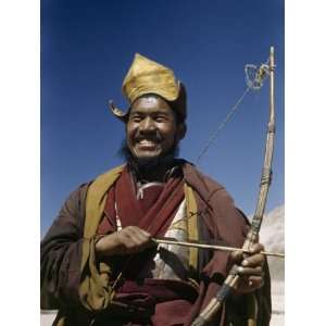  Yellow Hat Lama Holds Bow and Arrow Used in Sports, Not 