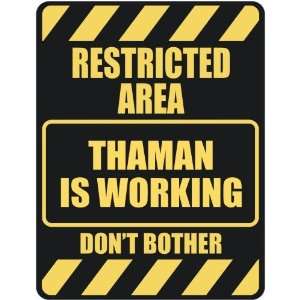   RESTRICTED AREA THAMAN IS WORKING  PARKING SIGN