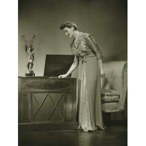  Woman in Evening Dress Standing Indoors, Holding Hand on 