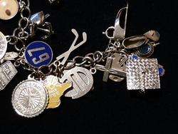 VINTAGE STERLING SILVER CHARM BRACELET WITH 31 STERLING CHARMS  