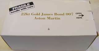   MINT 22KT GOLD JAMES BOND 007 ASTON MARTIN MODEL CAR IN ORIGINAL BOX