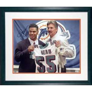 Junior Seau Miami Dolphins   Holding Jersey   Framed 16x20 Autographed 