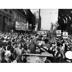 Richard M. Nixon and His Wife Campaigning in Open Car, Welcomed by 