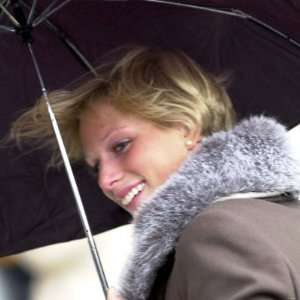 Zara Phillips Manages a Smile Despite the Weather at the Grand 